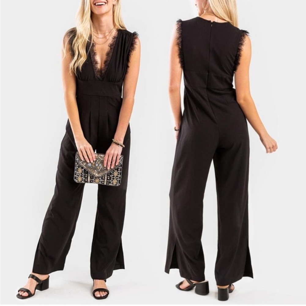 Francesca’s black sleeveless jumpsuit withh lace trim v neck with pockets